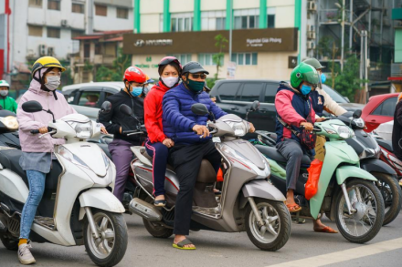 Commuters in masks in Hanoi, Vietnam, April 2020