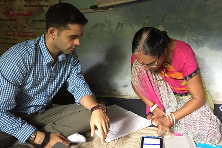 Aditya Mehta trains an Anganwadi worker