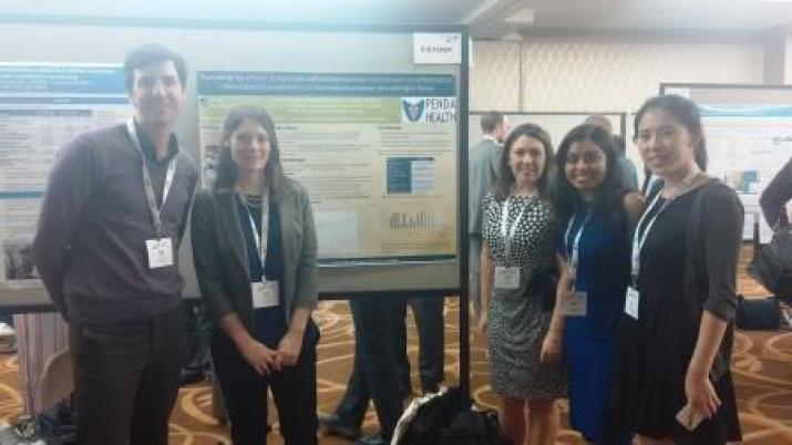 Bass team with our Penda Health research poster