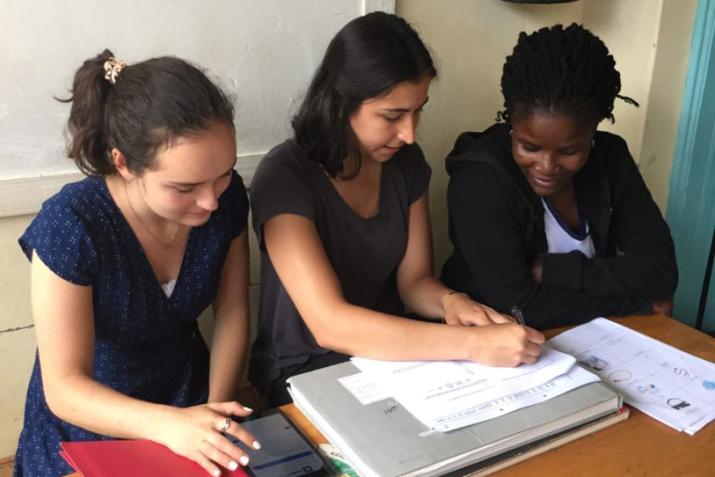 Suzanna Larkin and Emma Mehlhop carry out a questionnaire with a nursing officer in the Migori county of Kenya.