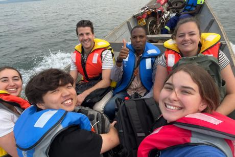 Daniel Lee and team on canoe in Uganda