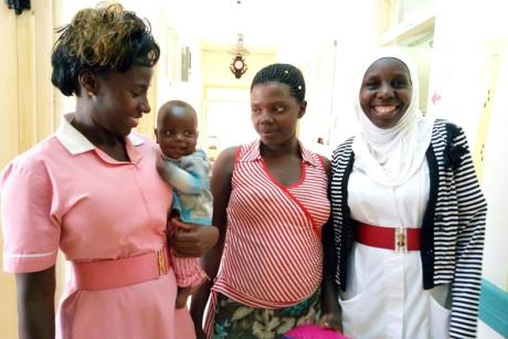 Baby Nathaniel with Mom and Two Nurses