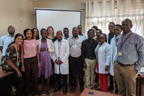 Yadurshini Raveendran (front row, far left) stands with the clinicians and study team at Bugando Medical Centre