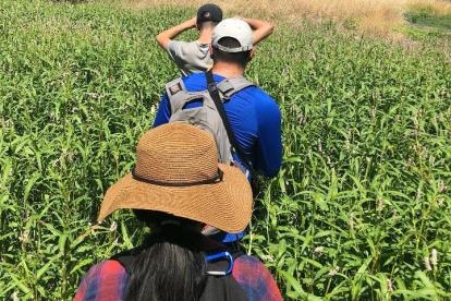 Sujeiry (front center) in Arizona, walking to leave water and food for migrant worker laboring in remote areas.