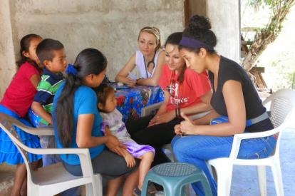 Students meet with a family in Honduras