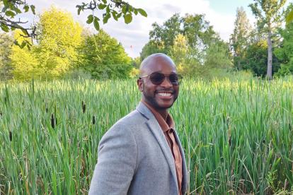 John Gaines III among high grass