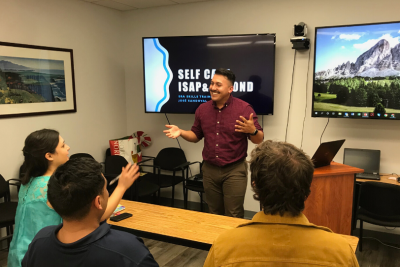 Sandoval is pictured leading a workshop on good research practices.